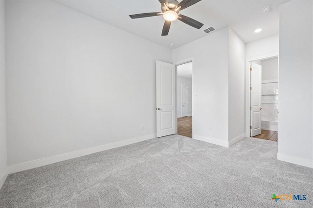 292 Scenic Cyn, New Braunfels, TX 78132 - unfurnished bedroom featuring carpet floors, ceiling fan, ensuite bathroom, and recessed lighting