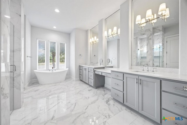 292 Scenic Cyn, New Braunfels, TX 78132 - bathroom featuring a chandelier, a marble finish shower, vanity, marble finish floors, and a freestanding bath
