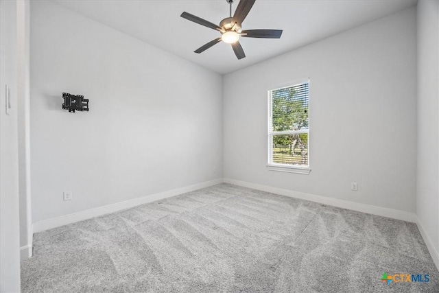 292 Scenic Cyn, New Braunfels, TX 78132 - carpeted spare room with baseboards and a ceiling fan