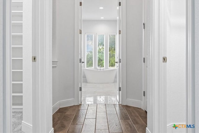 292 Scenic Cyn, New Braunfels, TX 78132 - corridor with baseboards and dark wood-style flooring