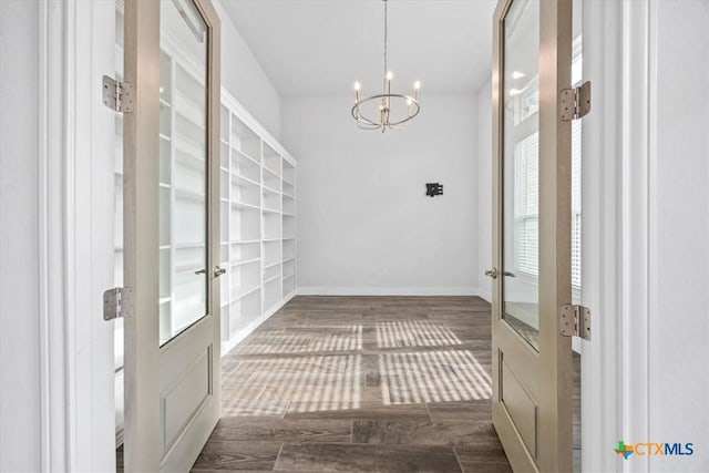292 Scenic Cyn, New Braunfels, TX 78132 - foyer with french doors, a chandelier, and wood finished floors