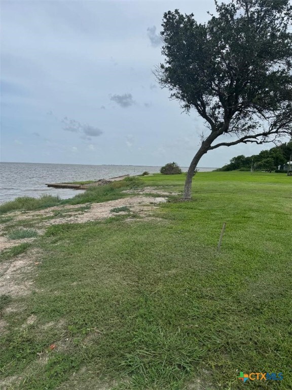1608 S Virginia St, Port Lavaca, TX 77979 - view of grassy yard with a water view