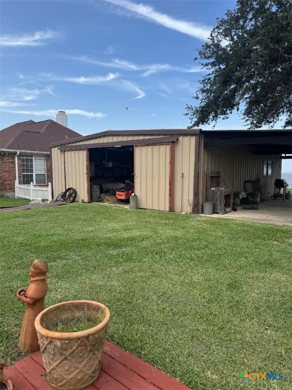 1608 S Virginia St, Port Lavaca, TX 77979 - view of pole building featuring a lawn