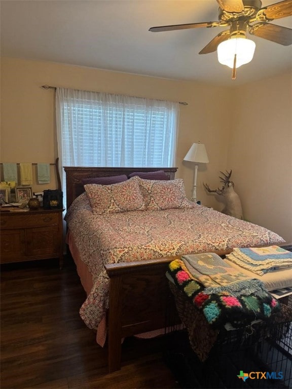 1608 S Virginia St, Port Lavaca, TX 77979 - bedroom with dark wood-type flooring and a ceiling fan