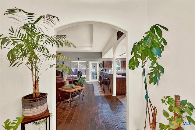 hallway with hardwood / wood-style flooring