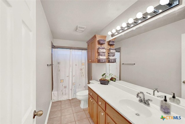 full bathroom featuring shower / bath combo, vanity, a textured ceiling, tile patterned floors, and toilet