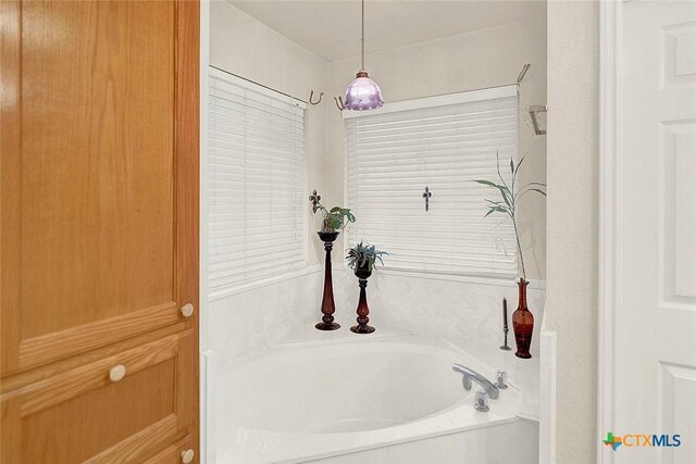 bathroom featuring a tub to relax in