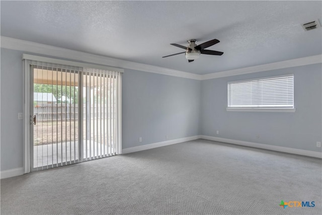 carpeted empty room with ceiling fan and ornamental molding