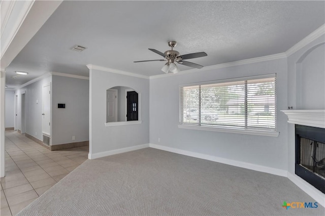 tiled living room featuring a textured ceiling, ceiling fan, and ornamental molding