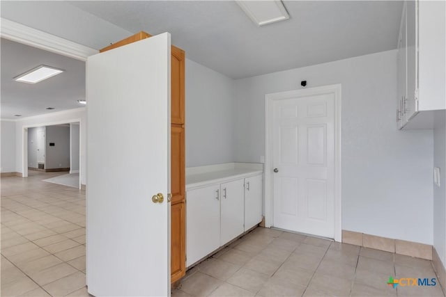 interior space with light tile patterned floors