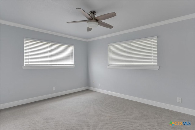 spare room with light carpet, ceiling fan, and ornamental molding