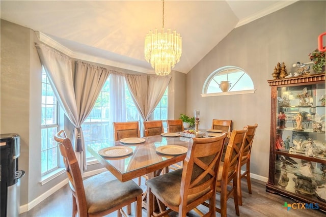4108 Red River Cir, Temple, TX 76504 - dining room with a chandelier, vaulted ceiling, plenty of natural light, wood finished floors, and crown molding