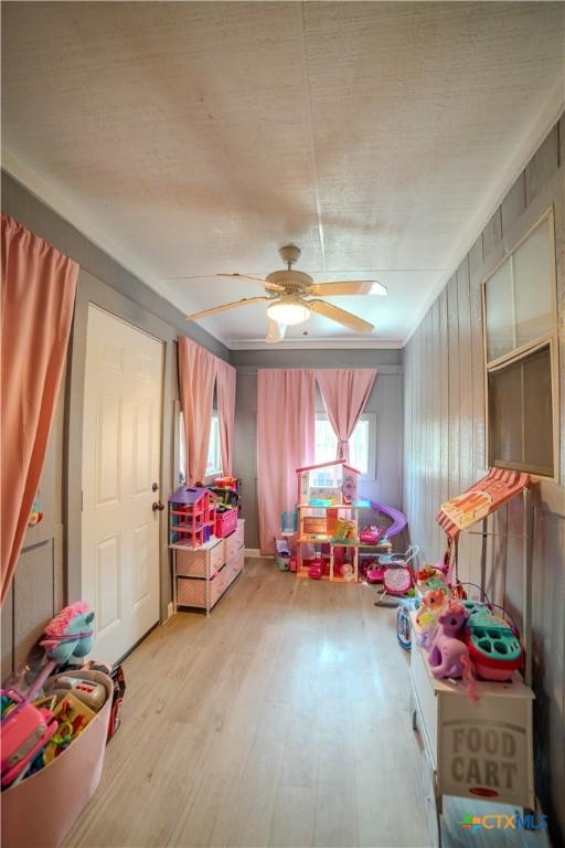 4108 Red River Cir, Temple, TX 76504 - playroom with wood finished floors, ceiling fan, and a textured ceiling