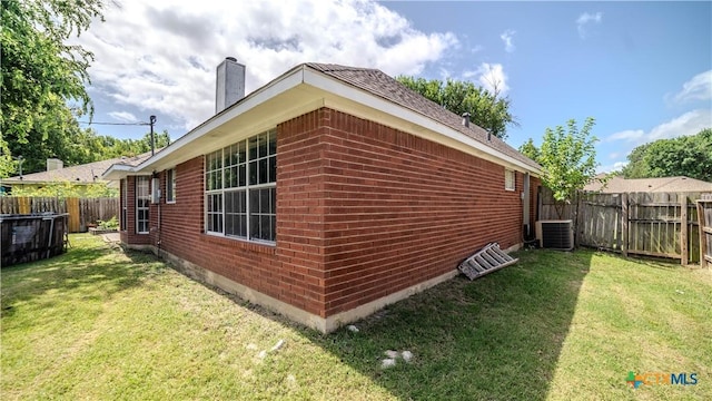 4108 Red River Cir, Temple, TX 76504 - view of side of property with brick siding, a chimney, and a fenced backyard