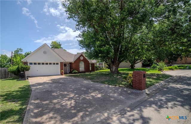 4108 Red River Cir, Temple, TX 76504 - ranch-style home with concrete driveway, an attached garage, and brick siding
