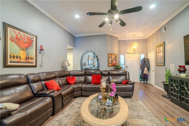 4108 Red River Cir, Temple, TX 76504 - living room with ceiling fan, light wood-style floors, ornamental molding, recessed lighting, and a chandelier