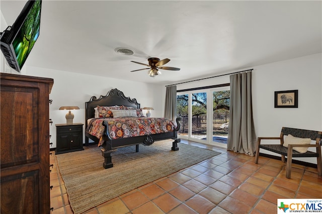 tiled bedroom featuring ceiling fan and access to outside