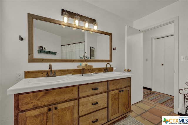 bathroom with vanity and tile patterned floors