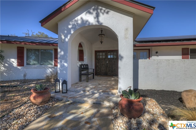 entrance to property featuring a patio area