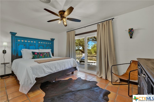 bedroom with access to exterior, ceiling fan, and light tile patterned floors