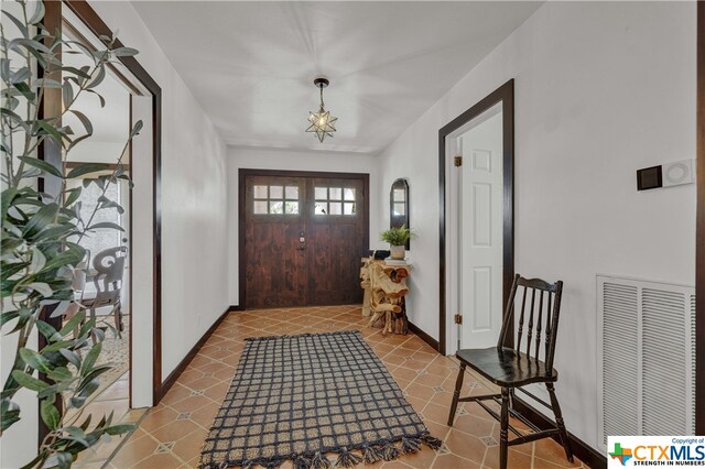 foyer with tile patterned flooring