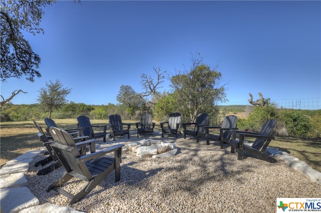 view of yard with an outdoor fire pit