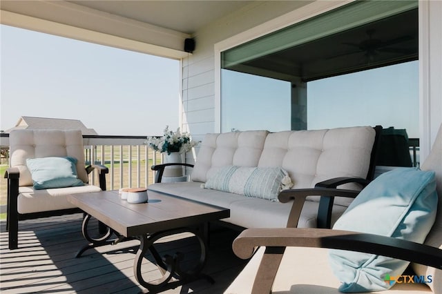 balcony featuring ceiling fan and an outdoor hangout area