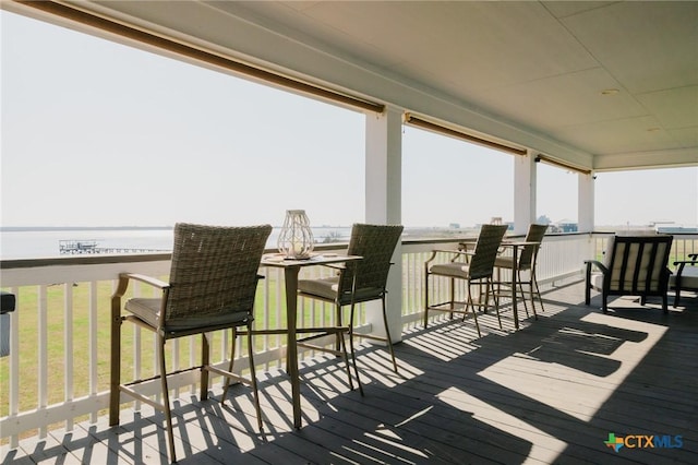 wooden terrace with a water view