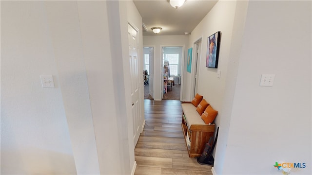 corridor featuring light hardwood / wood-style floors