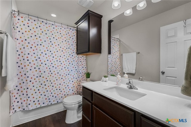 2020 Mallard Ct, Copperas Cove, TX 76522 - bathroom with vanity, wood finished floors, and shower / tub combo with curtain