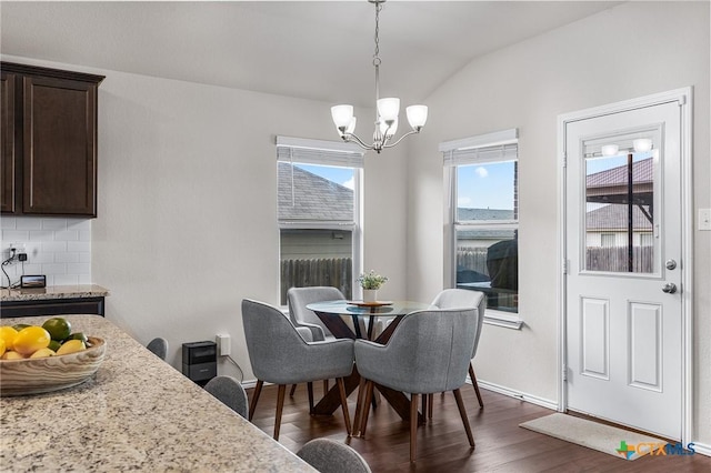 2020 Mallard Ct, Copperas Cove, TX 76522 - dining area with a chandelier, vaulted ceiling, and dark wood-style floors