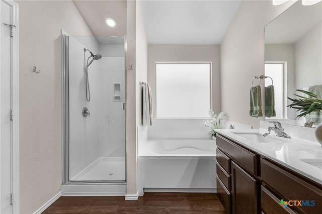 2020 Mallard Ct, Copperas Cove, TX 76522 - full bathroom featuring a shower stall, wood finished floors, a garden tub, double vanity, and recessed lighting