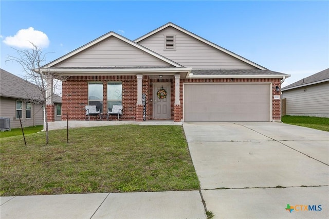 2020 Mallard Ct, Copperas Cove, TX 76522 - ranch-style home with brick siding, a front lawn, a garage, concrete driveway, and covered porch