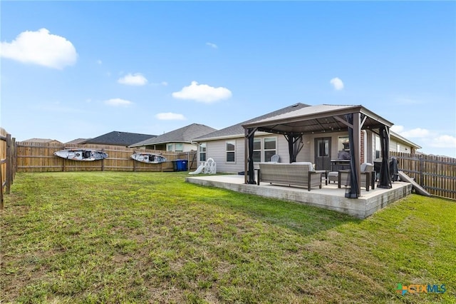 2020 Mallard Ct, Copperas Cove, TX 76522 - back of property featuring a gazebo, an outdoor hangout area, a patio area, and a fenced backyard