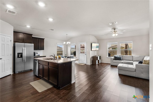 2020 Mallard Ct, Copperas Cove, TX 76522 - kitchen featuring appliances with stainless steel finishes, open floor plan, dark brown cabinets, dark wood-type flooring, and recessed lighting