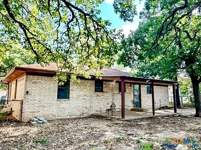 rear view of property with a patio