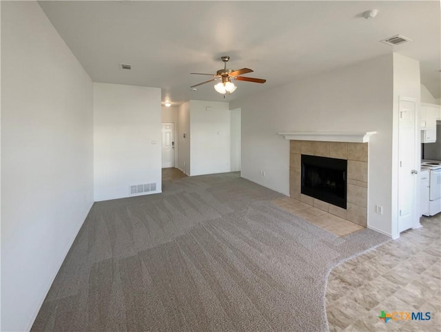 1116 Marlee Cir, Copperas Cove, TX 76522 - unfurnished living room with ceiling fan, independent washer and dryer, light carpet, and a tiled fireplace