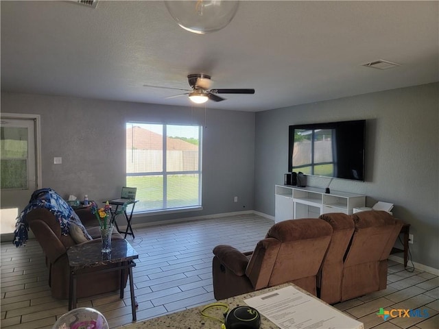 704 Jorgette Dr, Harker Heights, TX 76548 - living area with a ceiling fan and baseboards