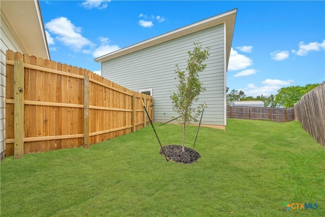 view of yard featuring a fenced backyard