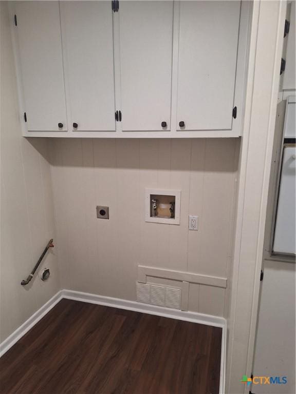 617 Allen St, Copperas Cove, TX 76522 - laundry area featuring dark wood-style floors, hookup for a washing machine, cabinet space, baseboards, and electric dryer hookup