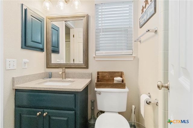 bathroom with vanity and toilet