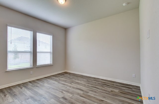 unfurnished room featuring light wood-type flooring