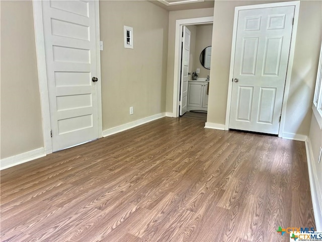 empty room with wood-type flooring