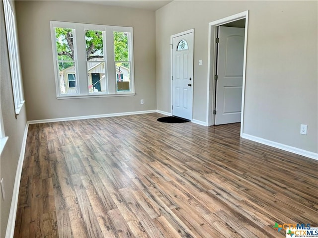 interior space with dark hardwood / wood-style flooring