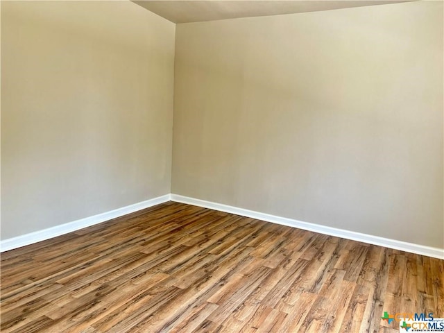 spare room featuring light hardwood / wood-style floors