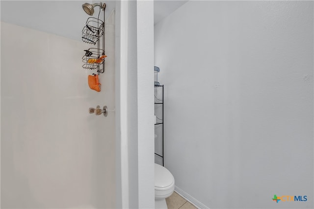 bathroom with tile patterned floors and toilet