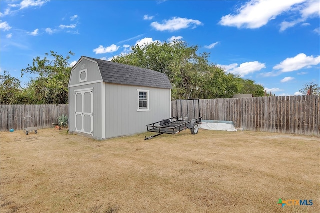 view of outdoor structure with a lawn