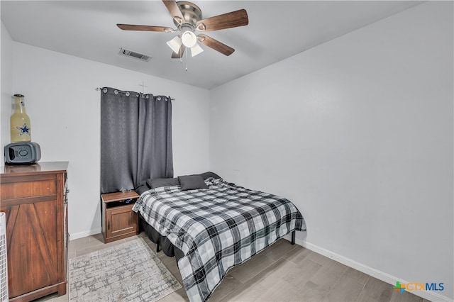 bedroom featuring light wood-type flooring and ceiling fan