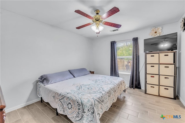 bedroom featuring light wood-type flooring and ceiling fan