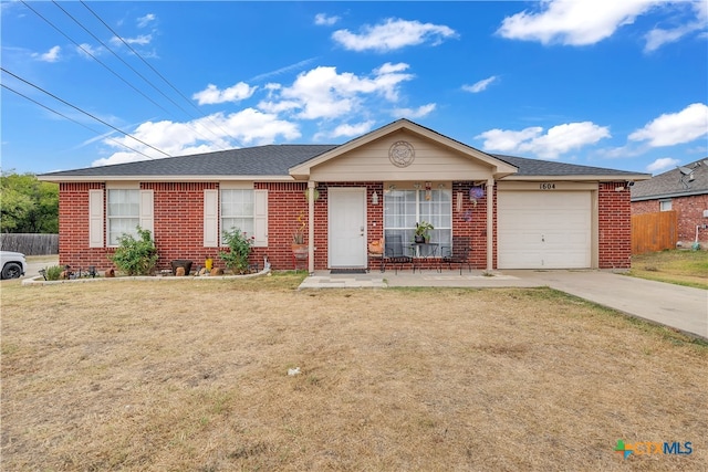 single story home featuring a garage and a front yard